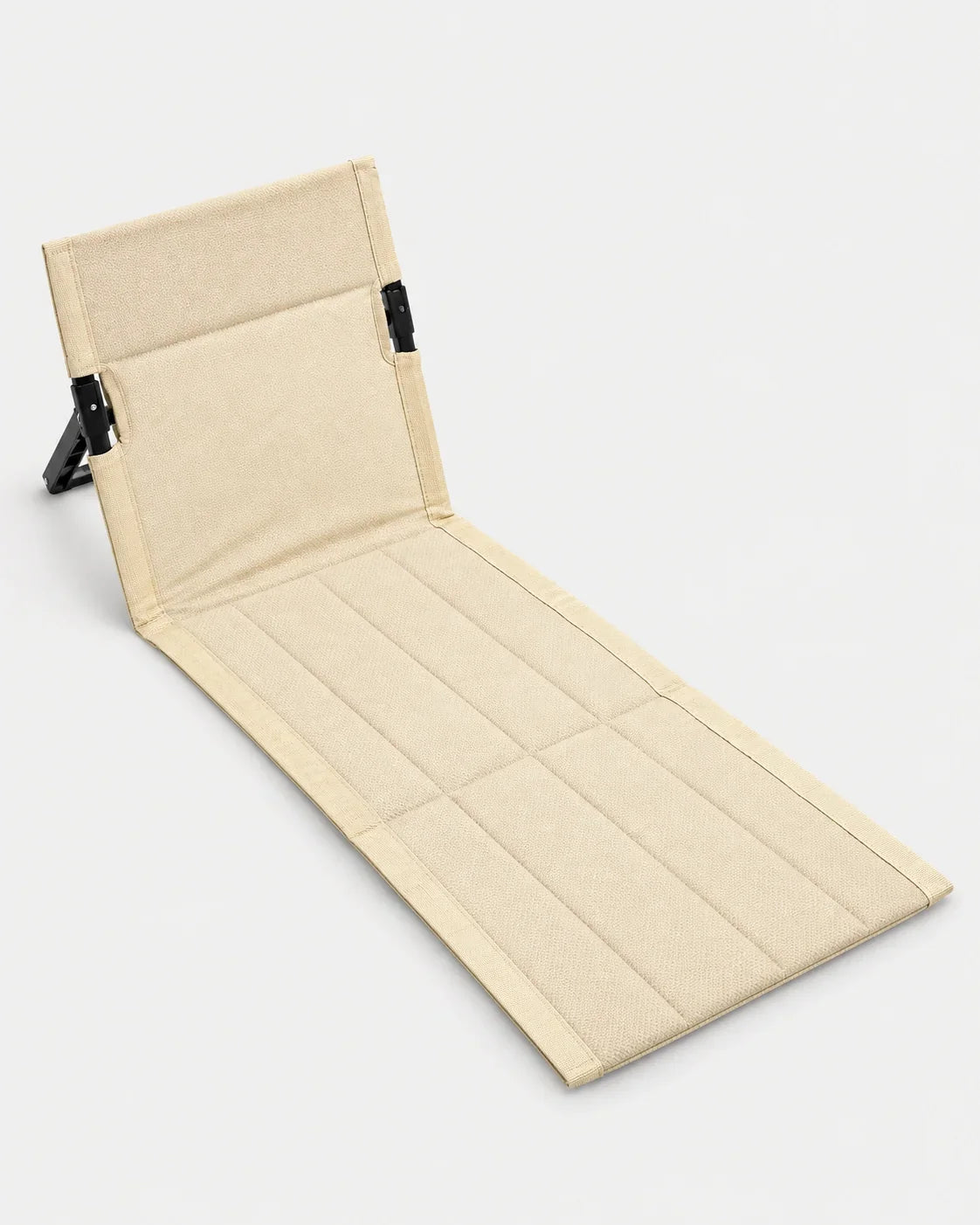 Alphes Shoreline folding beach chair in beige, laid out flat with its padded backrest propped up
